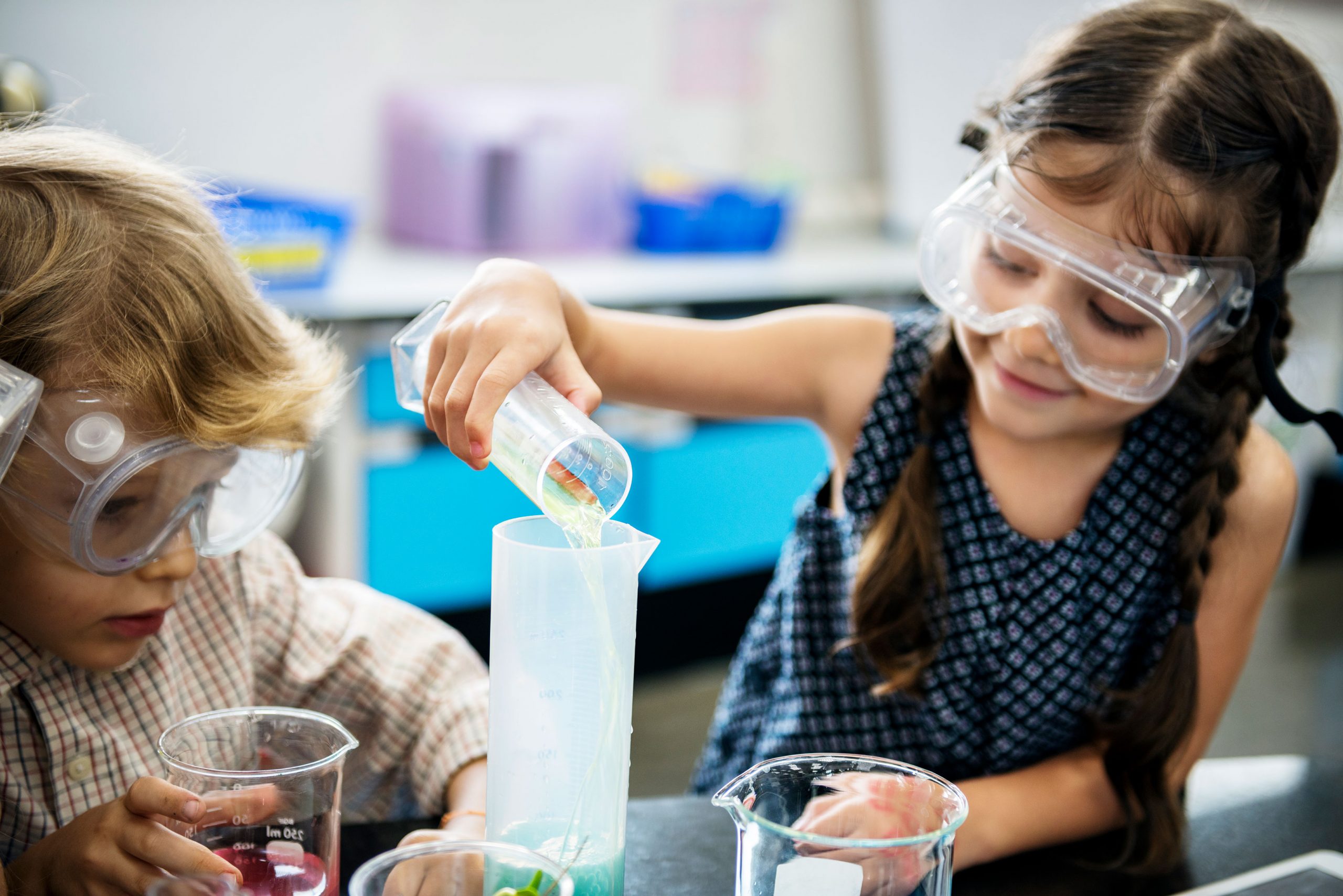 young girl and boy in lab